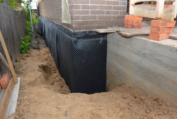 Happy homeowners after waterproofing job in Conklin